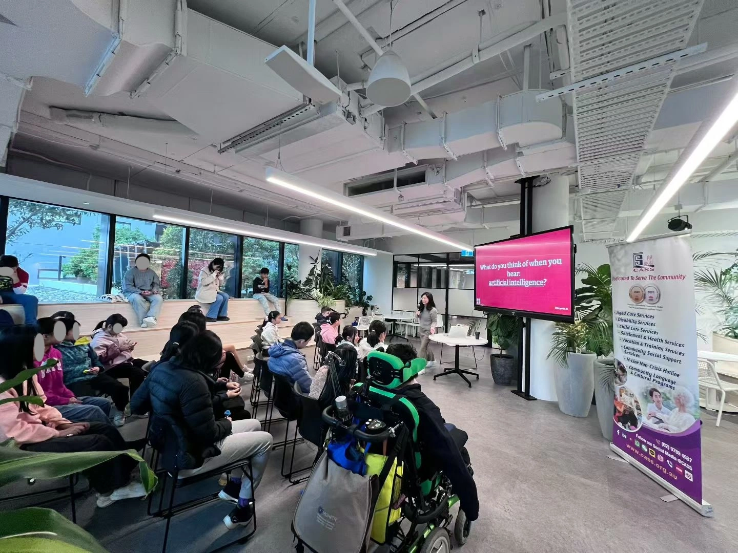 Students at an Inno AI session, working together with a laptop